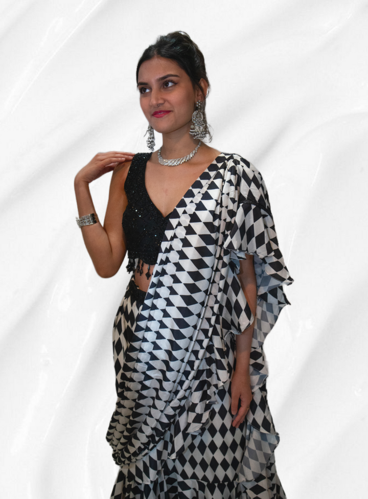 Black Embroidered Blouse With Layered Black And White Saree - Rent