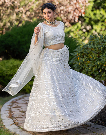 Radiant White Net Lehenga Set with Embellished Blouse and Dupatta