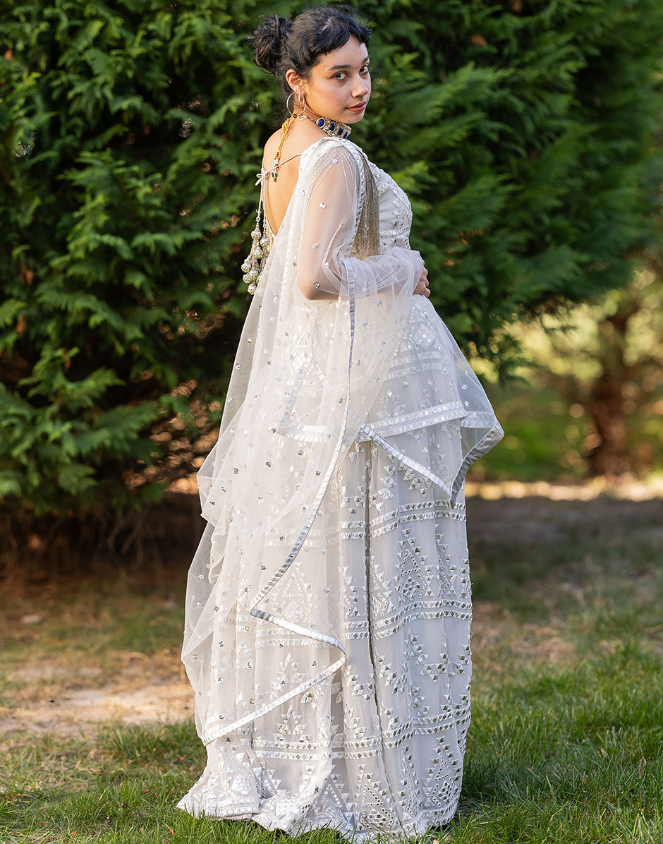 Radiant White Net Lehenga Set with Embellished Blouse and Dupatta