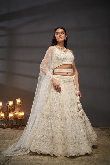 Awesome Cream Net Cutdana, Sequins and Zarkan  Lehenga choli & Dupatta - Rent.