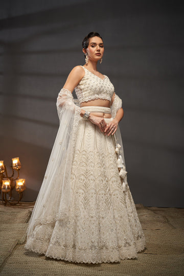 Awesome Cream Net Cutdana, Sequins and Zarkan  Lehenga choli & Dupatta - Rent
