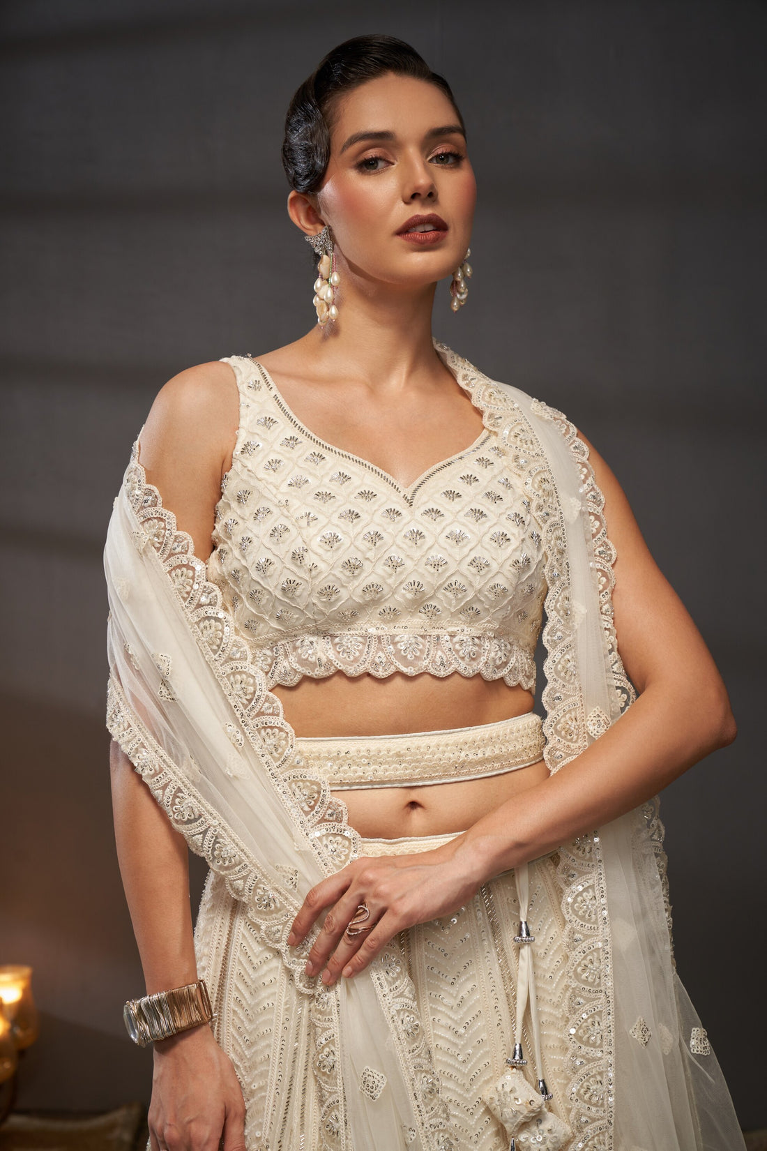 Awesome Cream Net Cutdana, Sequins and Zarkan  Lehenga choli & Dupatta - Rent