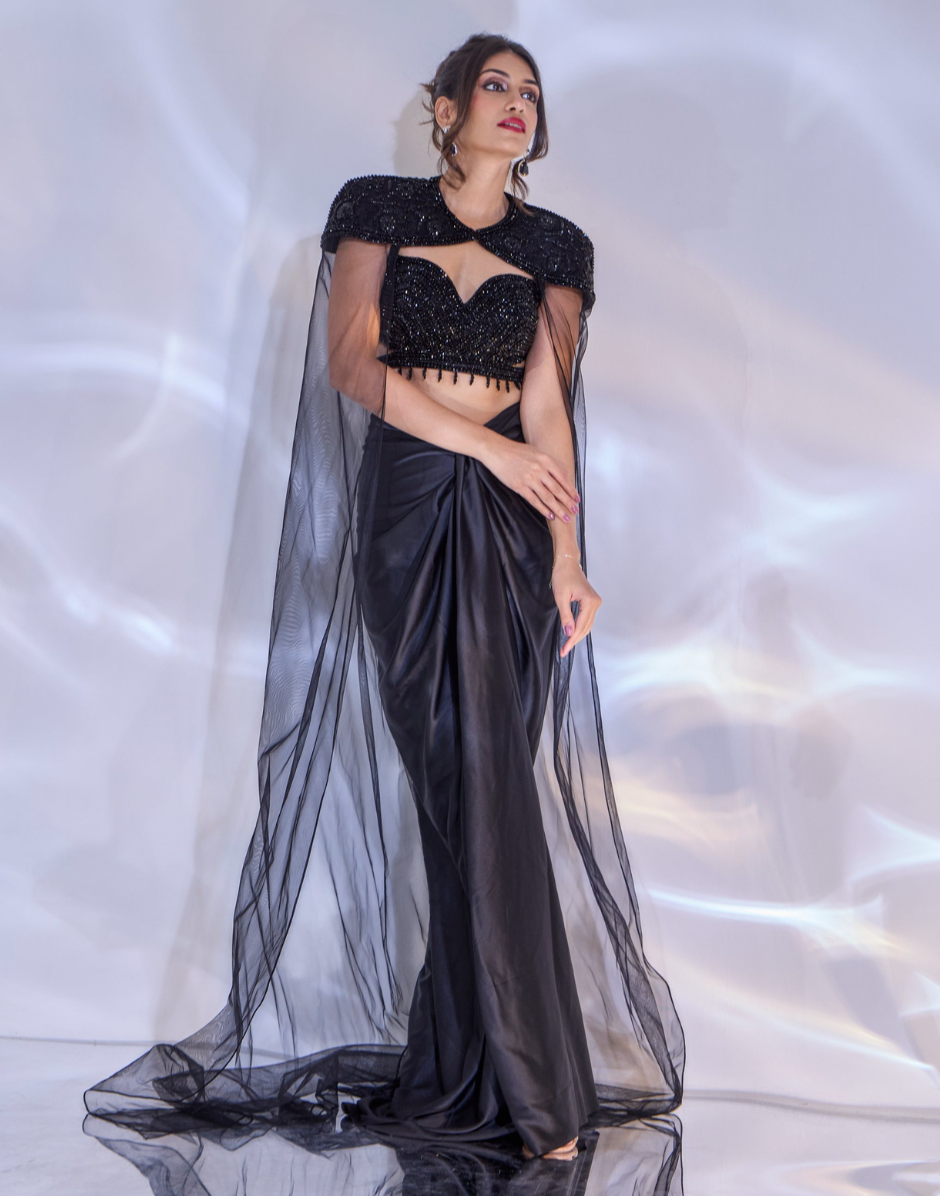Black Embellished Jeevon Cape Set with Cut-Out Blouse, Satin Drape Skirt & Net Trail Cape