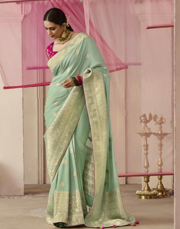 Chic Sea Green Dola Silk Saree Featuring Intricate Flower Pattern Weaving