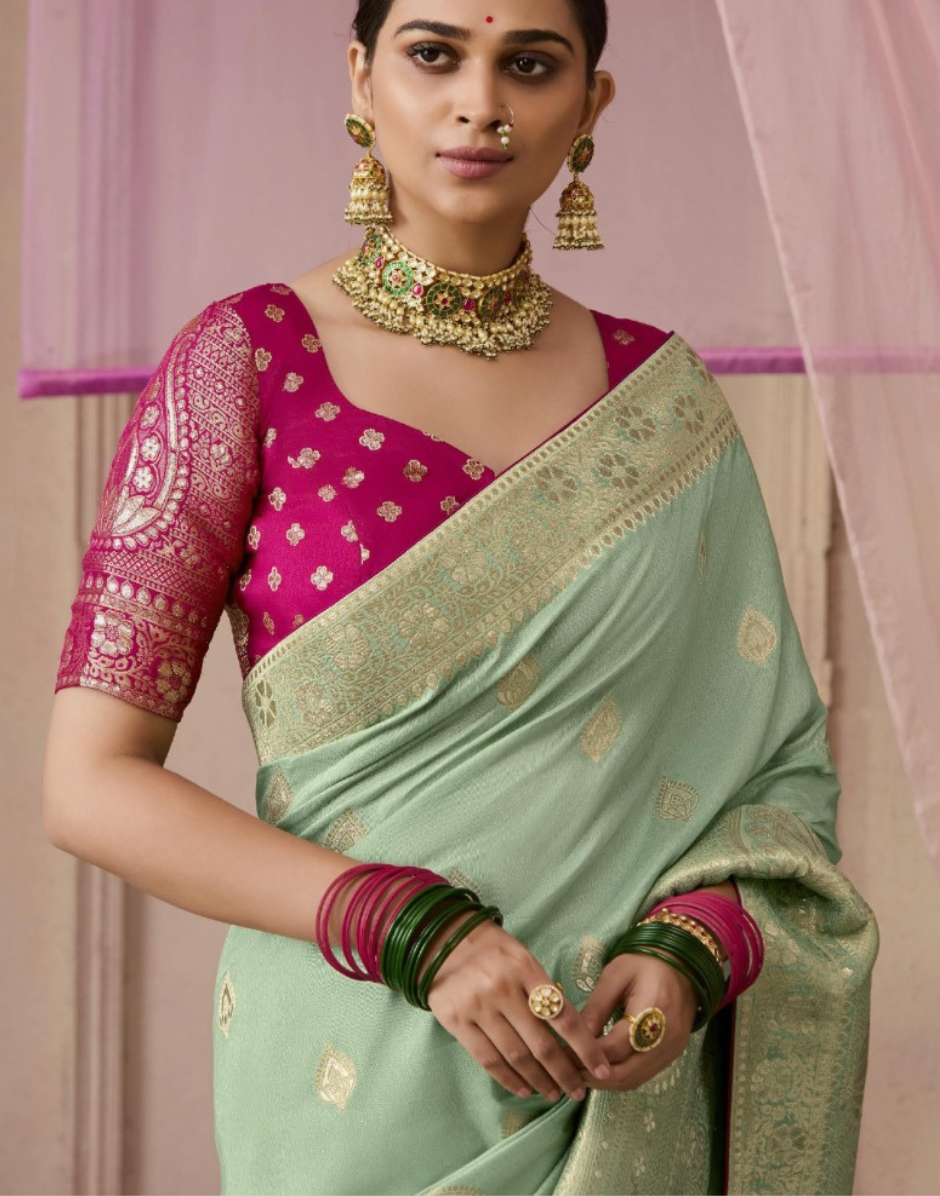 Chic Sea Green Dola Silk Saree Featuring Intricate Flower Pattern Weaving