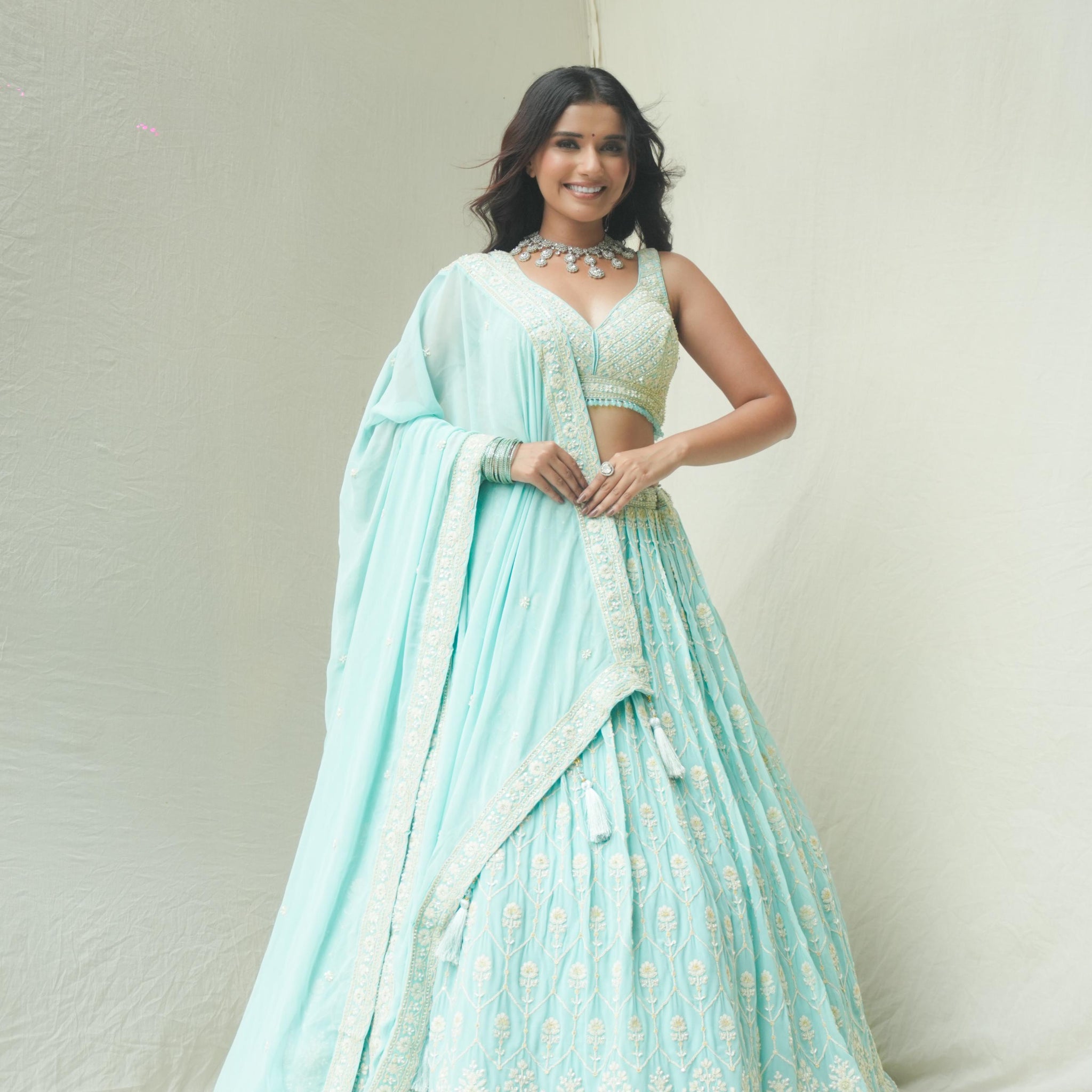 Delicate Beauty in Pastel Blue Lehenga - Rent