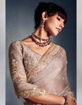 Luxurious Beige Tissue Organza Saree with Embellished Border Featuring Moti, Cutdana & Khatli Work_1