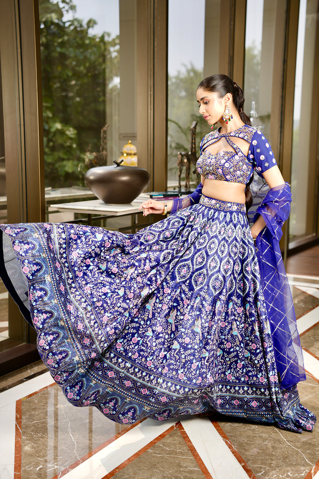 Rashika Sharma's Blue Printed Velvet Shriya Lehenga with hand embroidered cut out blouse- Rent