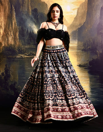 Stylish Sophistication Black Printed Suede Lehenga with Pleated Embroidered Net Blouse and Tassel Details