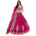 Glamourental fuchsia silk lehenga choli set with intricate beadwork, sequin embellishments, and designer dupatta.