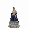 Glamourental Royal Navy embellished embroidered lehenga set with blouse and dupatta. Features intricate silver embroidery on navy blue fabric, perfect for weddings.