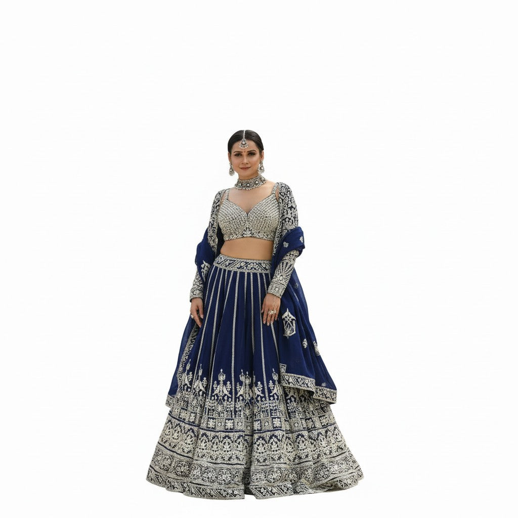 Glamourental Royal Navy embellished embroidered lehenga set with blouse and dupatta. Features intricate silver embroidery on navy blue fabric, perfect for weddings.