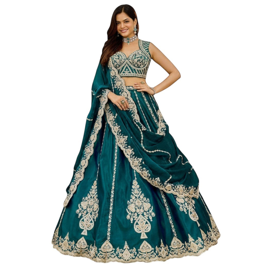 Glamourental teal silk lehenga choli set with intricate beadwork, sequin embellishments, and designer dupatta.