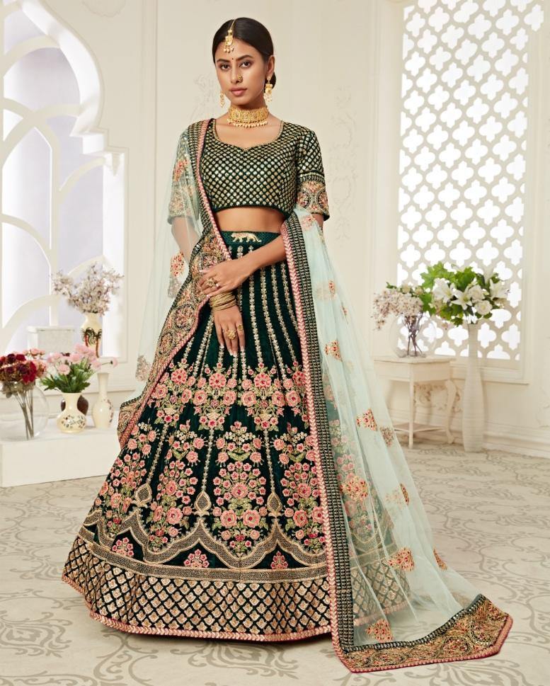 Green Heavy Bridal Wear Lehenga Choli + Creamy Brown embroidered Potli + Kundan Pearl Necklace Set- Rent