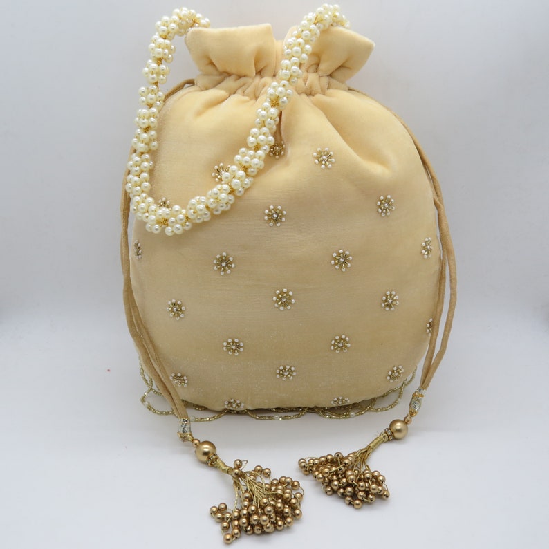 Beautiful Cream embroidered Potli - Rent_1