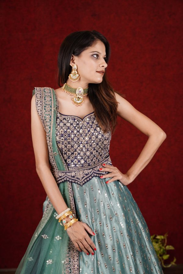 Classy Green colored Anarkali Set with Blue enhancement - Rent