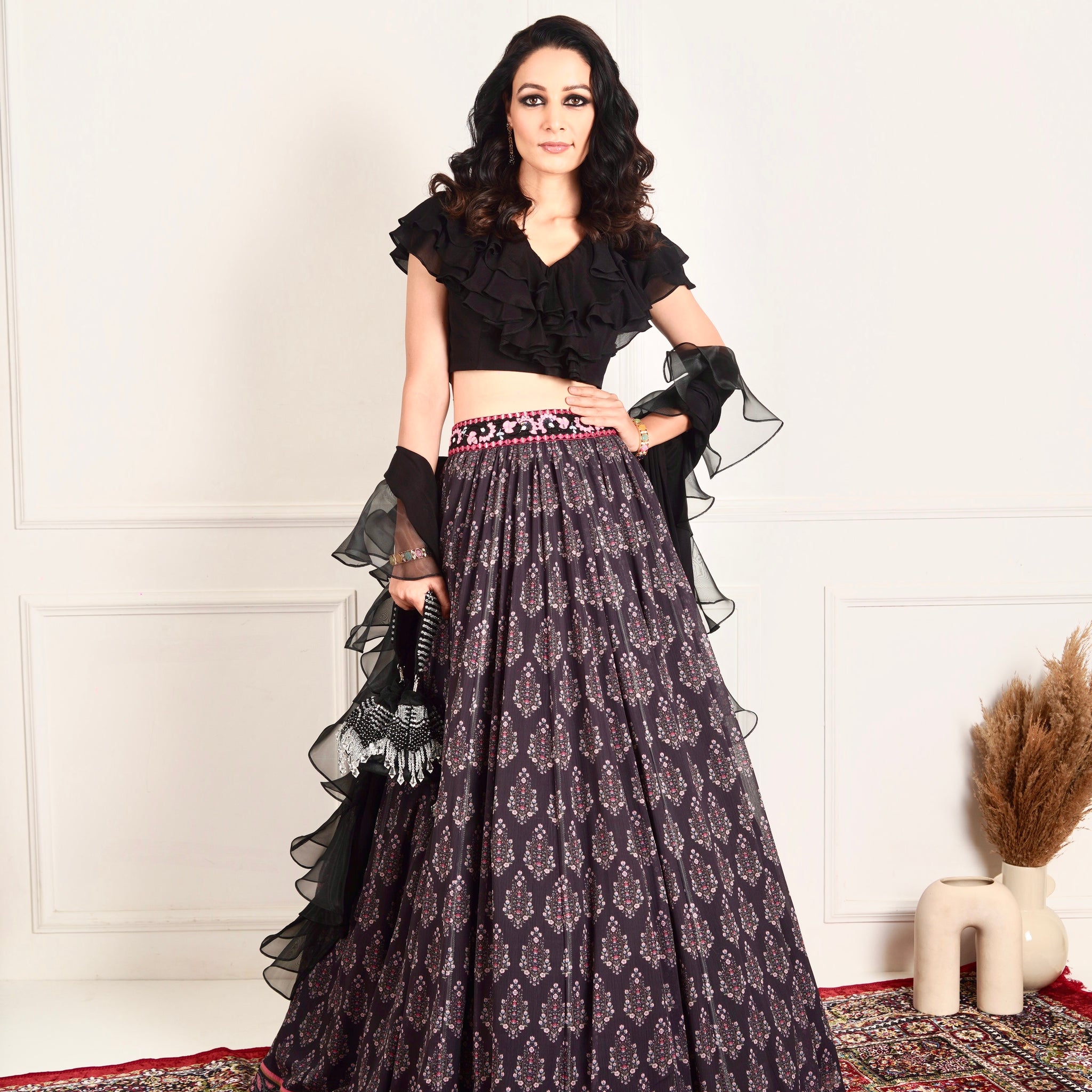 Designer Rashika's Black ruffled blouse and printed lehenga- Rent