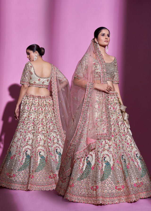 Uniquely designed Cream Heavy Embroidered Lehenga Set - Rent